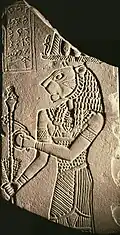 Votive plaque of king Tanyidamani and Apedemak, The Naqa kiosk, Excavation by John Garstang, 1909-1910, in the Temple of Apedemak; c.&nbsp;100&nbsp;BC; siltstone; 18.5 × 9.5&nbsp;cm Walters Art Museum