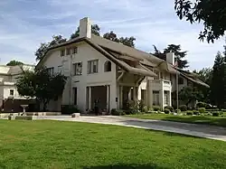 Side view showing two floors plus an attic