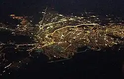 Aerial view of El Paso, Texas, and Ciudad Juárez, Chihuahua; the brightly lighted border can clearly be seen as it divides the two cities at night.