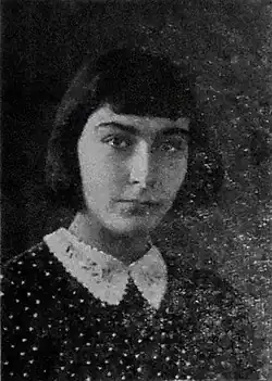 A grainy black and white photograph of a woman
