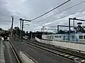 Southbound view of the station platforms, August 2024
