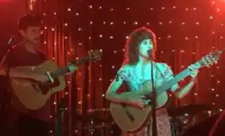 Emma and Nate in concert in 2021