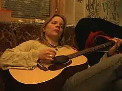 Emmi playing guitar