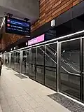 Signage and doors at platform level.