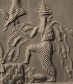 Ea or Enki, depicted on a cylinder seal with streams of fish spouting from his shoulders. Refer to caption