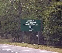 A sign stating "Welcome to Connecticut and the Merritt Parkway"