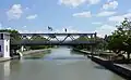 A lift bridge near its upward position, pedestrians may cross when it is raised by using stairways
