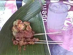 Sate kikil and sate gembus served on pincuk banana leaf bowl