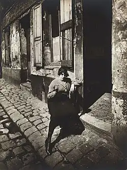 Prostitute waiting in front of her door, 1921