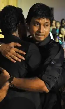 Yoosuf Shafeeu hugging a friend