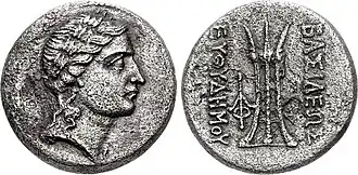 Cupro-nickel coin of Euthydemus II, c. 185–180 BC with Laureate head of Apollo, and Tripod on the reverse.