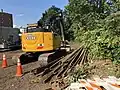 Excavator with rail removed from Watertown Branch for Phase II path construction, Sept. 2018
