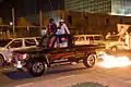 Foreigners participating in the night parade of the Qatar National Day