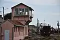 Pink facility, level crossing & freight train in Thouars, western France