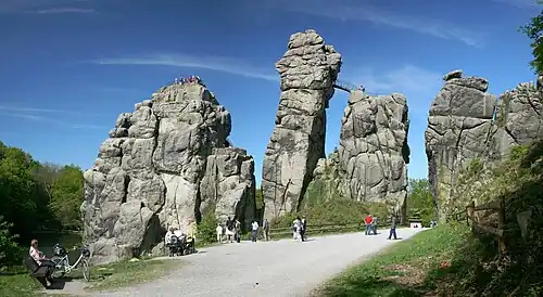 Image 7 Externsteine Photo credit: Daniel Schwen The Externsteine, a distinctive rock formation located in the Teutoburger Wald region of northwestern Germany, are a popular tourist attraction. Stairs and a small bridge connecting two of the rocks lead to the top.