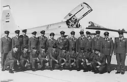 IIAF officers in front of an F-5E.