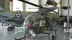 The museum's Bell 47G displayed in the foreground, Supermarine Spitfire Mk.16 behind, Cierva C.30A autogyro in the upper right and B-26 in the background