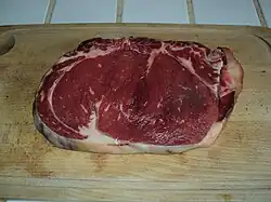 An uncooked sirloin steak