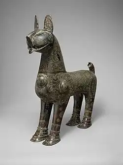 "A demonstration of the excellence achieved in metalwork under the Seljuqs": bronze incense burner shaped like lion, with removable head, dated 1181–82 CE, Taybad, Iran. (Metropolitan Museum of Art)[178][179]