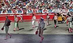 Bullfighters performing the parade before the bullfight in a bullring in Colombia.