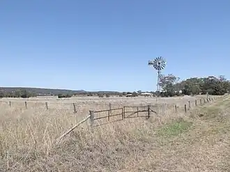 Fields and windmill along Biddeston Linthorpe Road, 2014