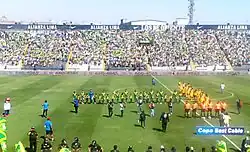 Players from both teams lined up on the field