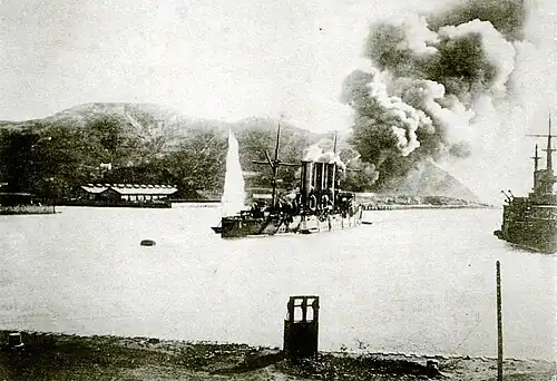 Pallada under fire as the Oil Depot burns