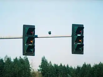 3M traffic signals in Shelton, Washington, as seen off-axis from the intended viewing area. These signals appear to be "off" or invisible to adjacent lanes of traffic during the daytime. Only a faint glow can be seen when viewed at night.