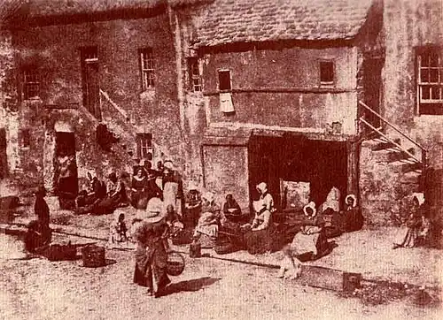 Fishwives in St Andrews bait their lines, 1844