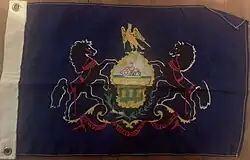 Older state flag with a golden eagle