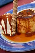 Flan con helado, a Spanish dessert with a barquillo