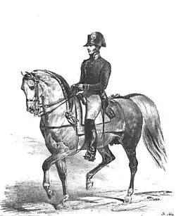 A uniformed military man in bicorne rides a gray horse in bridle