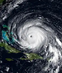A satellite image of Hurricane Floyd. The storm is mature and well-defined, with a pronounced eye feature. Floyd is located over the Atlantic Ocean, to the north of Hispaniola and east of the Bahamas.
