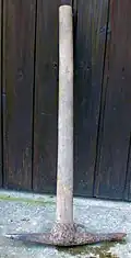 A pick with welded number and eye for the tool ring