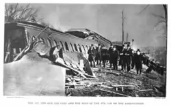 The first three cars, and the roof of the fourth car, on the embankment