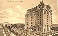 Postcard from 1913, printed in sepia tone depicting the exterior of a 12-storey chateaueasque hotel