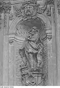 Vulcan, the Roman god of smithing with hammer, anvil, and forge at the Crown Gate of the Dresden Zwinger, 1715 (hist. photo 1945, Deutsche Fotothek).