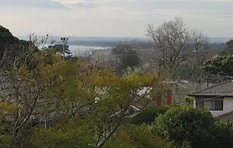 Rooftops of Frankston South, with glimpses of Port Phillip and Seaford Pier