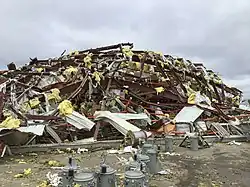 Image 123EF3 damage to a large metal-framed warehouse building at the Black River Electric Co-op in Fredericktown, Missouri. (from Tornadoes of 2021)