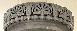 Frieze of the lost capital of the Allahabad pillar, with two lotuses framing a "flame palmette" surrounded by small rosette flowers, 3rd BCE