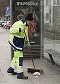 Street sweeper at the bus stop in Parkallé in Aarhus