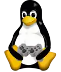 Tux sitting with a gamepad