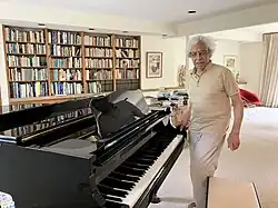 The scientist George Philander with his piano in his Princeton home in August 2025