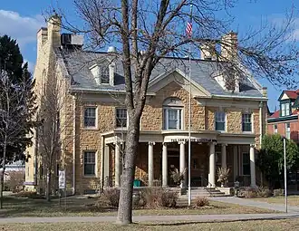 Photo of exterior of stately stone house