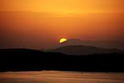 Sunset over Giritale Wewa and mountains