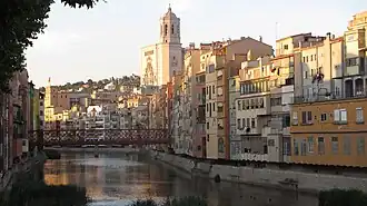 View of the cathedral, with the Eiffel Bridge over the Onyar in the foreground