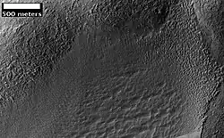 Possible Glacial Cirque in Hellas Planitia, as seen by HiRISE, under the HiWish program. Lines are probably due to downhill movement.