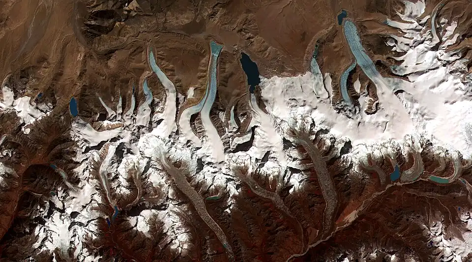 Image 2Glacier retreat is a type of glacial motion in which more material ablates from its terminus of the glacier than is replenished by flow into that region. In this region of the Bhutan-Himalaya, glacial lakes have been rapidly forming on the surface of the debris-covered glaciers and researchers have found a strong correlation between increasing temperatures and glacial retreat. (Credit: NASA & USGS.) (from Portal:Earth sciences/Selected pictures)