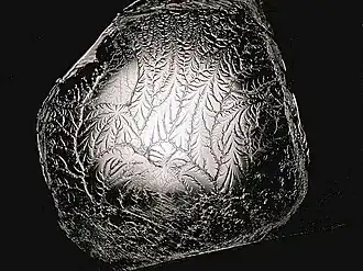 A fractal is formed when pulling apart two glue-covered acrylic sheets.