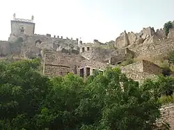 Hilltop fort complex with stone ramparts and gateways